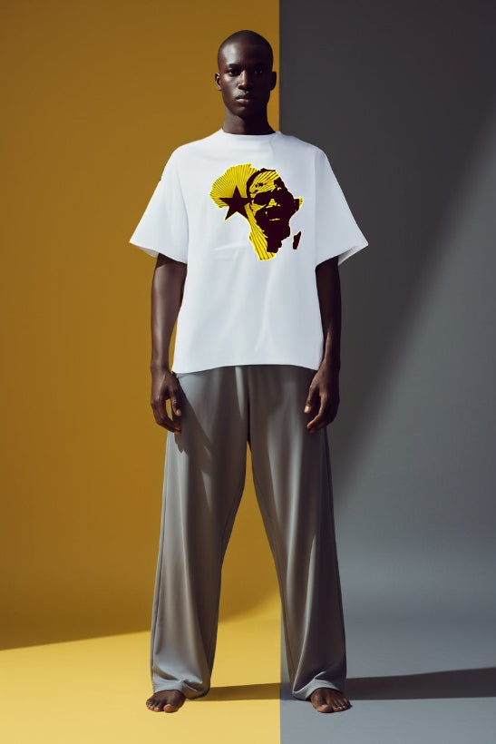 Person wearing a white t-shirt with a graphic design on a two-tone background